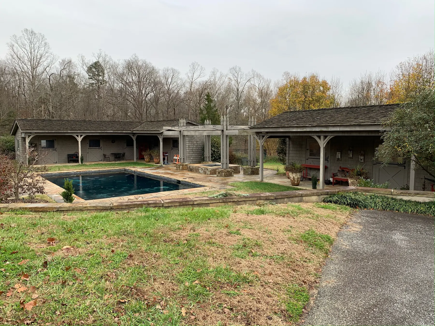 Outdoor courtyard and pool beside a custom residence