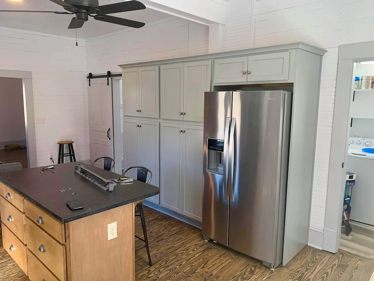 Custom kitchen cabinetry and island in a completed renovation