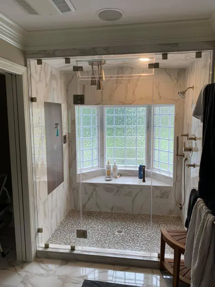 Finished primary bath with marble-look shower